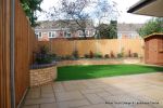 Curved brick planter wall using old stock bricks with single bull nose capping