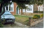 BEFORE: Tired driveway and lawn that doesn't suit the character property