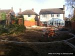 DURING: Lawn is removed topsoil installed and levelled and patio starts to take shape