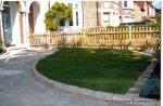 AFTER: Driveway constructed using Tegula paving with sweeping curved path to front door and feature band across drive mouth, new wall, lawn and planting installed.