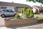 Driveway installed with Marshalls Driveline 50 in a mix of colours with Charcoal soldier course