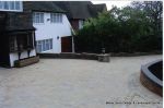 New driveway installed using Marshall's Tegula paving with contrasting charcoal border