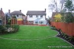 Tired garden received a complete new design Patio installed with 4 size sawn sandstone paving edged with firestone rocks and alpine planting, steps built with sawn sandstone uprights and sawn sandstone bullnose treads, New lawn installed in 3 rings all ed