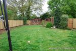 BEFORE: The patio was poorly built and to small and the lawn and beds were drab and tired looking