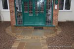 AFTER: Sweeping sandstone path installed leading to front door, driveway perimeter edged with sandstone setts all hand pointed, Natural sandstone wall constructed with crease tile and 6mm Scottish beach gravel installed to drive.