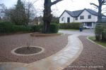 AFTER: Sweeping sandstone path installed leading to front door, driveway perimeter edged with sandstone setts all hand pointed, Natural sandstone wall constructed with crease tile and 6mm Scottish beach gravel installed to drive.