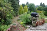 Before: The garden to this character property was mature but very random with no structure the current patio was to small for the clients when they had family gatherings. 