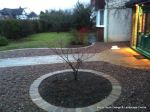 AFTER: Sweeping sandstone path installed leading to front door, driveway perimeter edged with sandstone setts all hand pointed, Natural sandstone wall constructed with crease tile and 6mm Scottish beach gravel installed to drive.