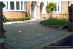 Driveway constructed using Tegula paving with sweeping curved path to front door and feature band across drive mouth, new wall, tier drop lawn and planting installed.