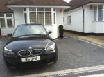 New driveway installed using granite paving with contrasting colour band and inset lights