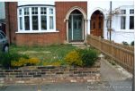 BEFORE: Tired driveway and lawn that doesn't suit the character property