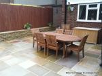 Patio installed with 4 size sawn sandstone paving edged with firestone rocks and alpine planting, steps built with sawn sandstone uprights and sawn sandstone bullnose treads