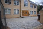 AFTER: Driveway was constructed with tumbled paver's in graphite grey, brick wall and pillars built using matching brick to property   