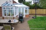 BEFORE: The patio was poorly built and to small and the lawn and beds were drab and tired looking