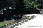 Access to children's play area built via a steep slope with Irish rockery, decorative gravel and sleepers ready for planting