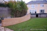 Property was resdential care home ramped pathway was constructed leading from the front of the property to the very rear, retaining walls built with interlocking blocks with added rebar and fresh concrete for strength and faced with house brick, Composite