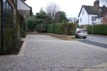 Sweeping sandstone path installed leading to front door, driveway perimeter edged with sandstone setts all hand pointed, Natural sandstone wall constructed with crease tile and 6mm Scottish beach gravel installed to 