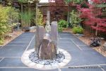 Town house garden paved with black limestone 