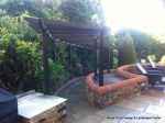 Garden needed a new landscape to match the character of the property a Sweeping ramp was installed with timber curved arbour, tumbled sandstone paving & circle installed and in cased with old stock brickwork capped with double bullnose steps built  with m