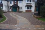 Sweeping sandstone path installed leading to front door, driveway perimeter edged with sandstone setts all hand pointed, Natural sandstone wall constructed with crease tile and 6mm Scottish beach gravel installed to 