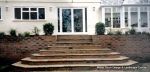 Sandstone patio installed on block & beam floor with octagon step