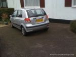 BEFORE: Tired and patchy old tarmac driveway