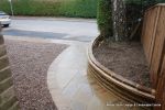 Sweeping sandstone path installed leading to front door, driveway perimeter edged with sandstone setts all hand pointed, Natural sandstone wall constructed with crease tile and 6mm Scottish beach gravel installed to drive