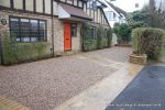 Sweeping sandstone path installed leading to front door, driveway perimeter edged with sandstone setts all hand pointed, Natural sandstone wall constructed with crease tile and 6mm Scottish beach gravel installed to drive