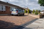 Curved Brick planter wall with crease tile and brick on edge to finish