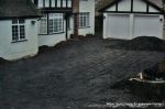 BEFORE: Old concrete driveway broken and crumbling