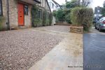 Sweeping sandstone path installed leading to front door, driveway perimeter edged with sandstone setts all hand pointed, Natural sandstone wall constructed with crease tile and 6mm Scottish beach gravel installed to 