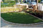 Driveway constructed using Tegula paving with sweeping curved path to front door and feature band across drive mouth, new wall, tier drop lawn and planting installed.