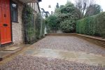 Sweeping sandstone path installed leading to front door, driveway perimeter edged with sandstone setts all hand pointed, Natural sandstone wall constructed with crease tile and 6mm Scottish beach gravel installed to drive