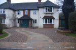 Sweeping sandstone path installed leading to front door, driveway perimeter edged with sandstone setts all hand pointed, Natural sandstone wall constructed with crease tile and 6mm Scottish beach gravel installed to drive